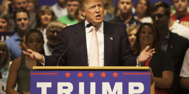 a man speaking at a podium