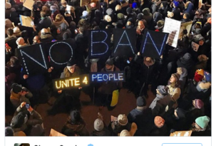 a group of people holding signs