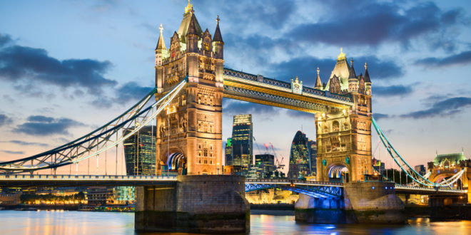 a bridge with towers and towers over water