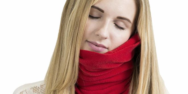 a woman with a red scarf around her neck