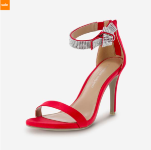 a red high heeled shoe with a bow